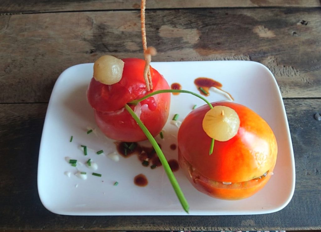 Stuffed tomatoes filled with sautéed vegetables and Cuban cheese at Giroud